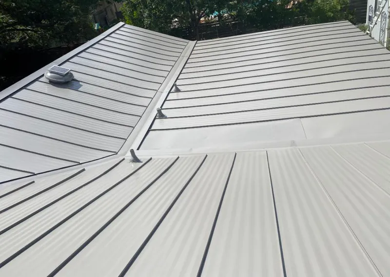 Solar attic fan installed on a metal roof for Roof Ventilation in Rhinelander